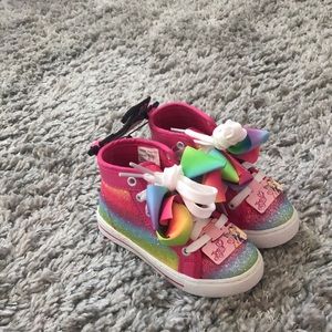 Jo Jo Siwa high top shoes.
